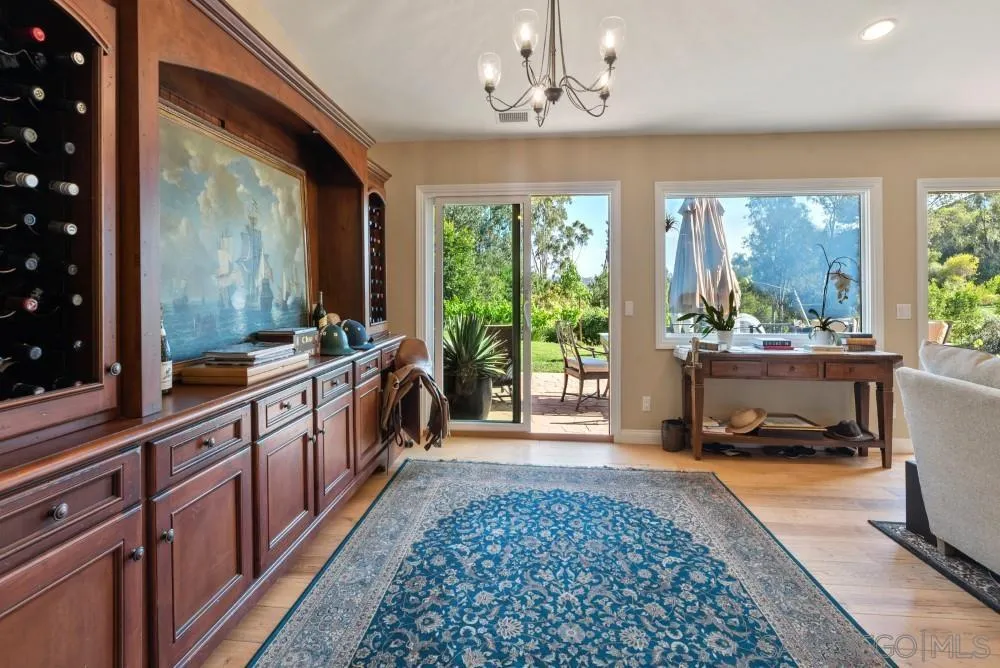 16919 Reposa Alta Rancho Santa Fe, CA 92067 - Photo 11 of 51 a large room with a large window and furniture