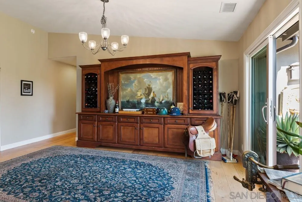 16919 Reposa Alta Rancho Santa Fe, CA 92067 - Photo 12 of 51 a living room with granite countertop furniture and a chandelier
