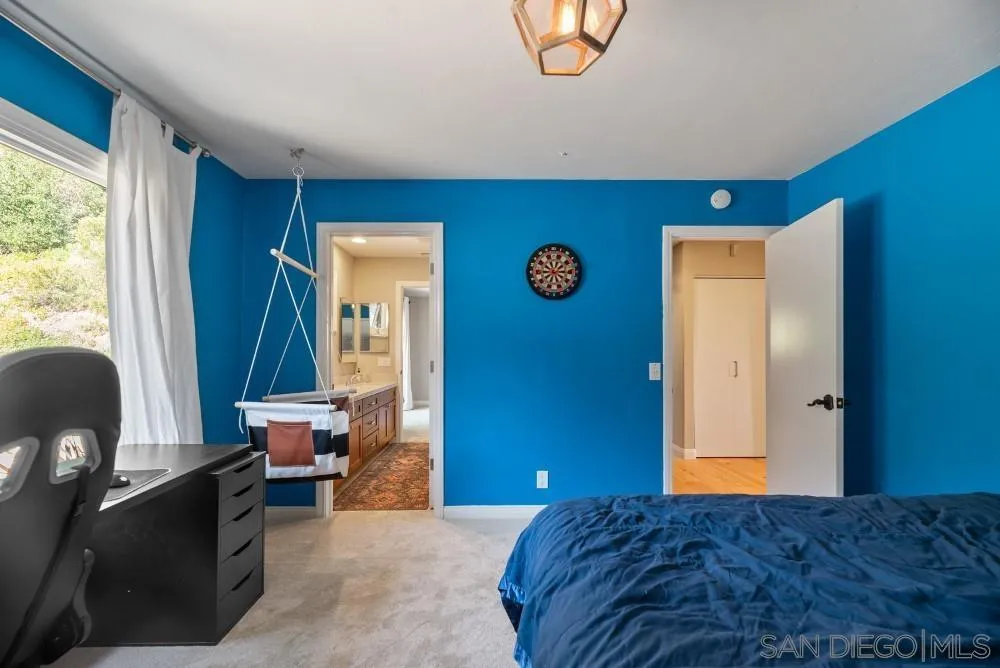 16919 Reposa Alta Rancho Santa Fe, CA 92067 - Photo 31 of 51 a bedroom with a bed and a window