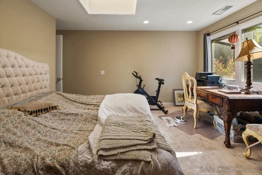 16919 Reposa Alta Rancho Santa Fe, CA 92067 - Photo 33 of 51 a bedroom with a bed and a window
