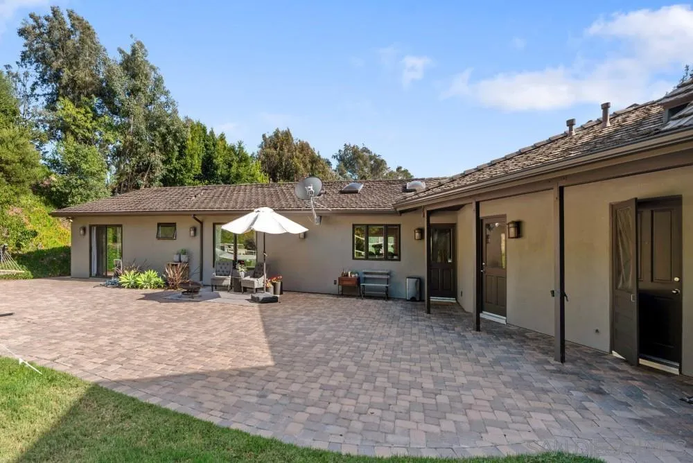 16919 Reposa Alta Rancho Santa Fe, CA 92067 - Photo 39 of 51 a view of a house with backyard porch and furniture
