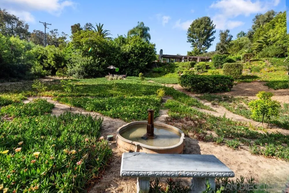 16919 Reposa Alta Rancho Santa Fe, CA 92067 - Photo 42 of 51 a wooden bench sitting in the middle of a park
