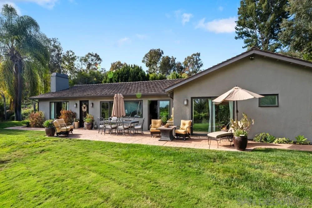 16919 Reposa Alta Rancho Santa Fe, CA 92067 - Photo 45 of 51 a view of a house with backyard and sitting area