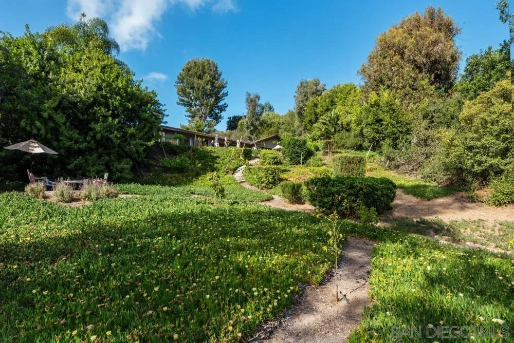 16919 Reposa Alta Rancho Santa Fe, CA 92067 - Photo 48 of 51 a view of a garden with plants and a building