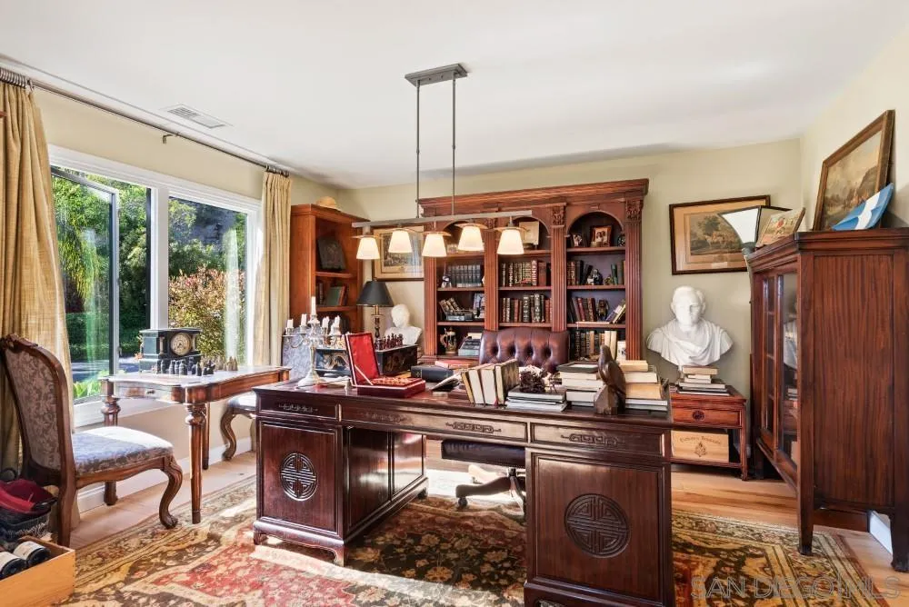 16919 Reposa Alta Rancho Santa Fe, CA 92067 - Photo 5 of 51 a living room with fireplace furniture and a window