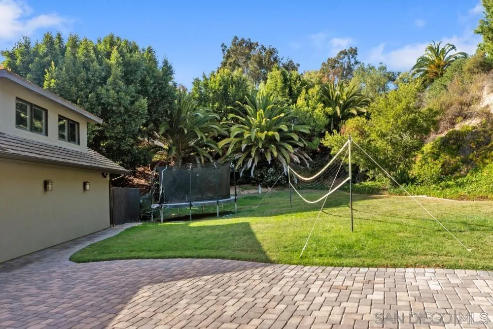 16919 Reposa Alta Rancho Santa Fe, CA 92067 - Photo 51 of 51 a front view of a house with garden