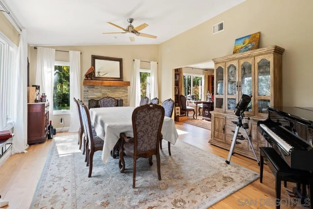 16919 Reposa Alta Rancho Santa Fe, CA 92067 - Photo 7 of 51 a view of a dining room with furniture window and wooden floor