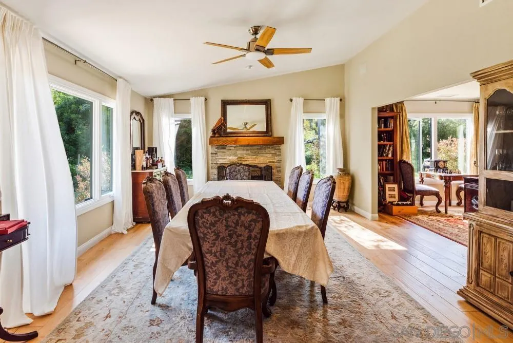 16919 Reposa Alta Rancho Santa Fe, CA 92067 - Photo 8 of 51 a view of a dining room with furniture window and wooden floor