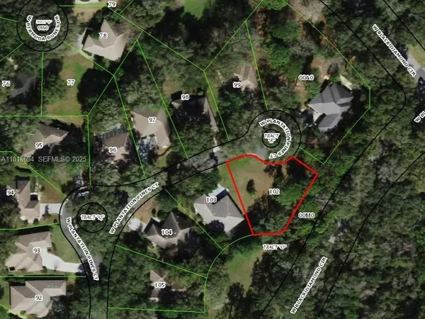an aerial view of residential house with outdoor space and parking