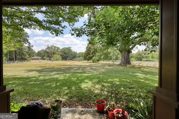 a view of outdoor space with deck and yard