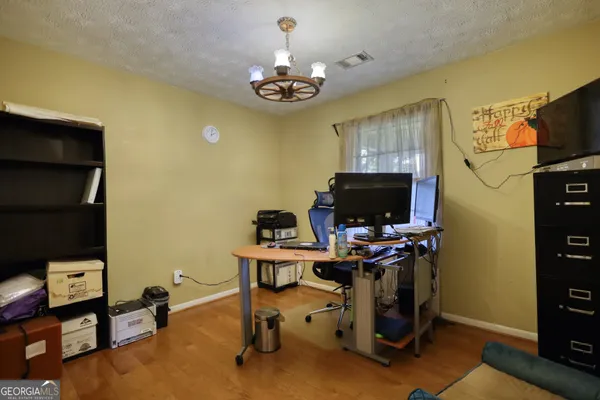 a view of a workspace with furniture