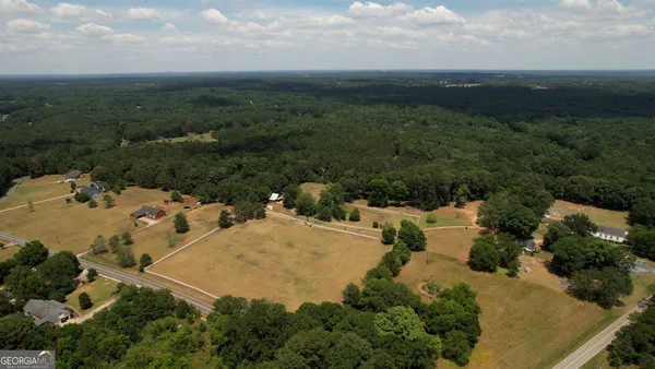 an aerial view of residential house with outdoor space