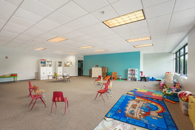 a bed room with furniture and a flat screen tv