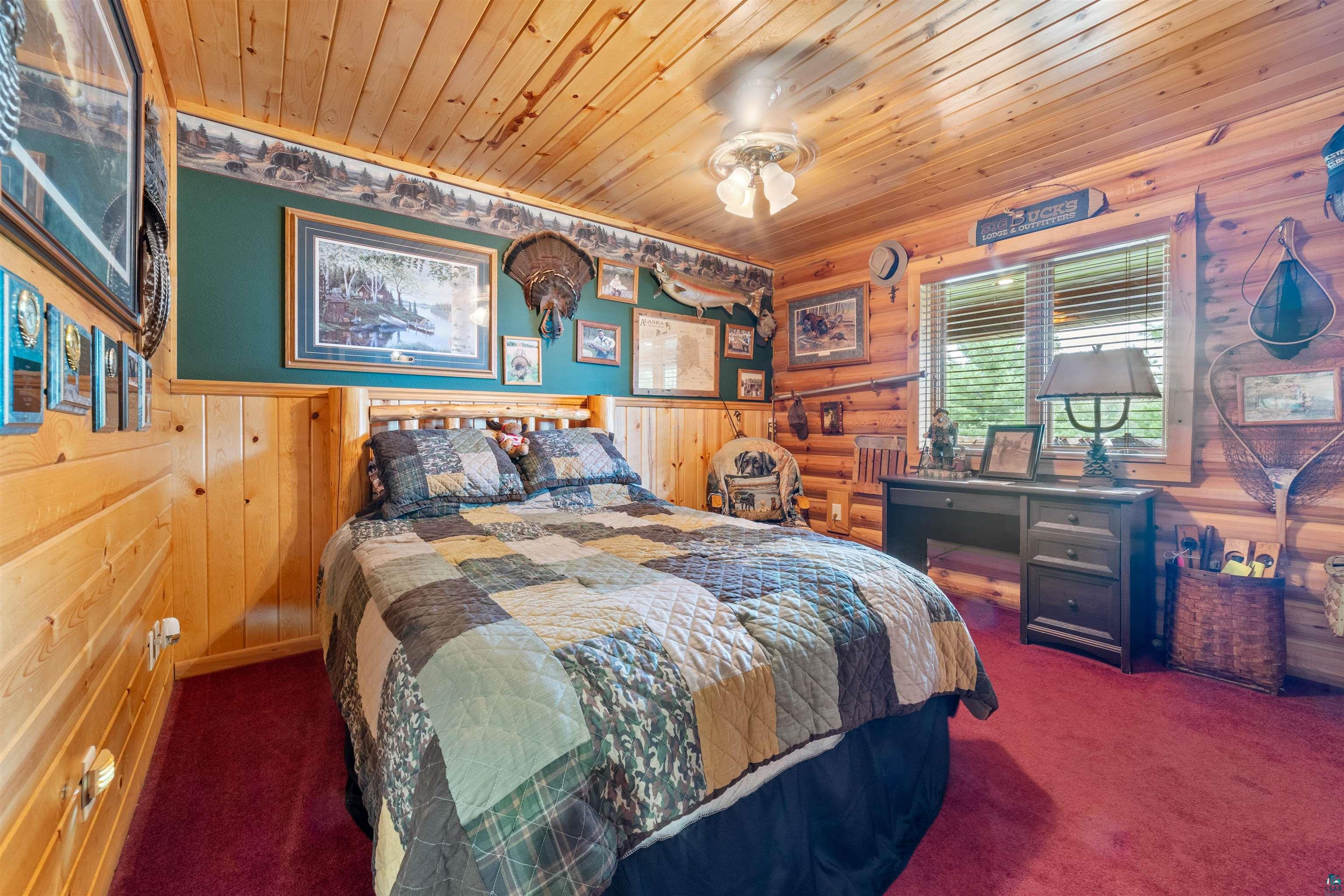 11911 East Rowe Road Lake Nebagamon, WI 54849 - Photo 48 of 61 Wood-paneled room featuring a window with horizontal blinds, built-in desk, and ceiling-mounted light fixture