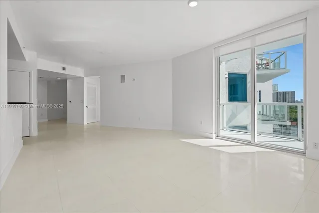 a view of an empty room with a fireplace