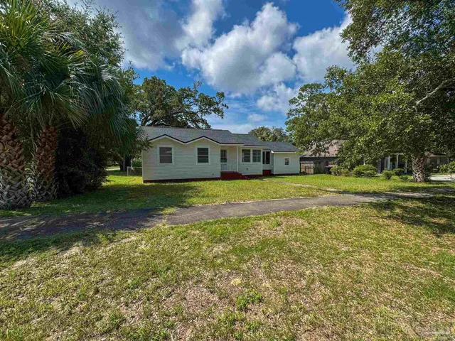 a view of a house with a big yard