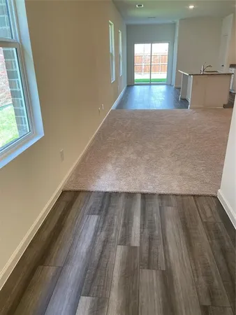 a view of a kitchen with a sink cabinets and a window