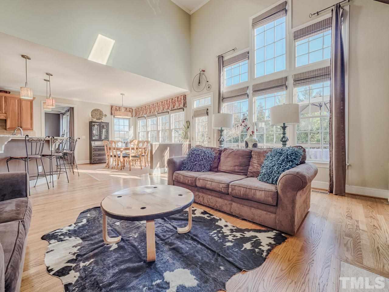 4604 Whitmire Place Raleigh, NC 27612 - Photo 13 of 25 a living room with furniture and a large window