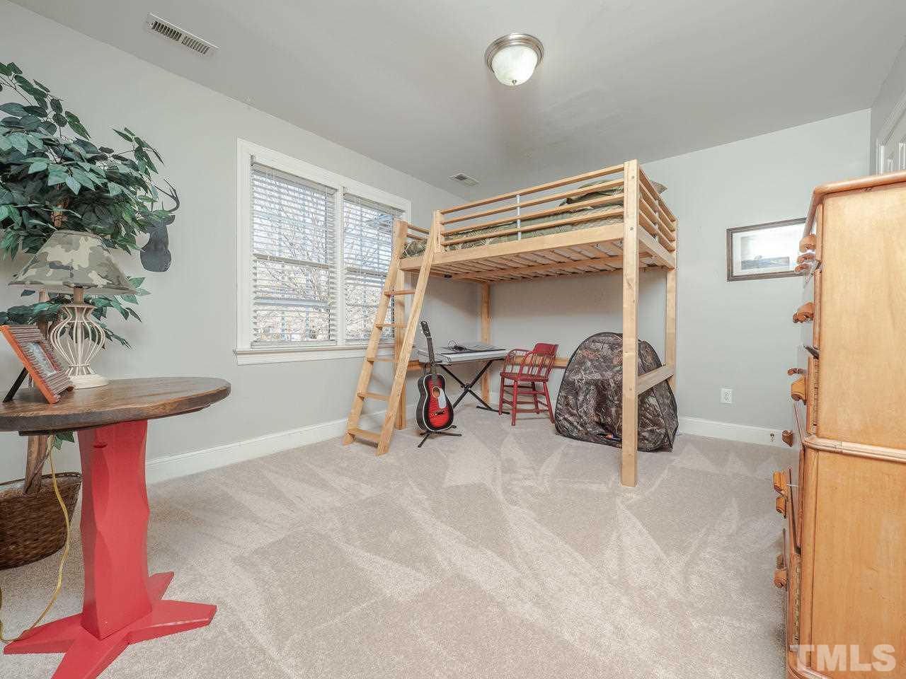 4604 Whitmire Place Raleigh, NC 27612 - Photo 18 of 25 a view of a room with gym equipment