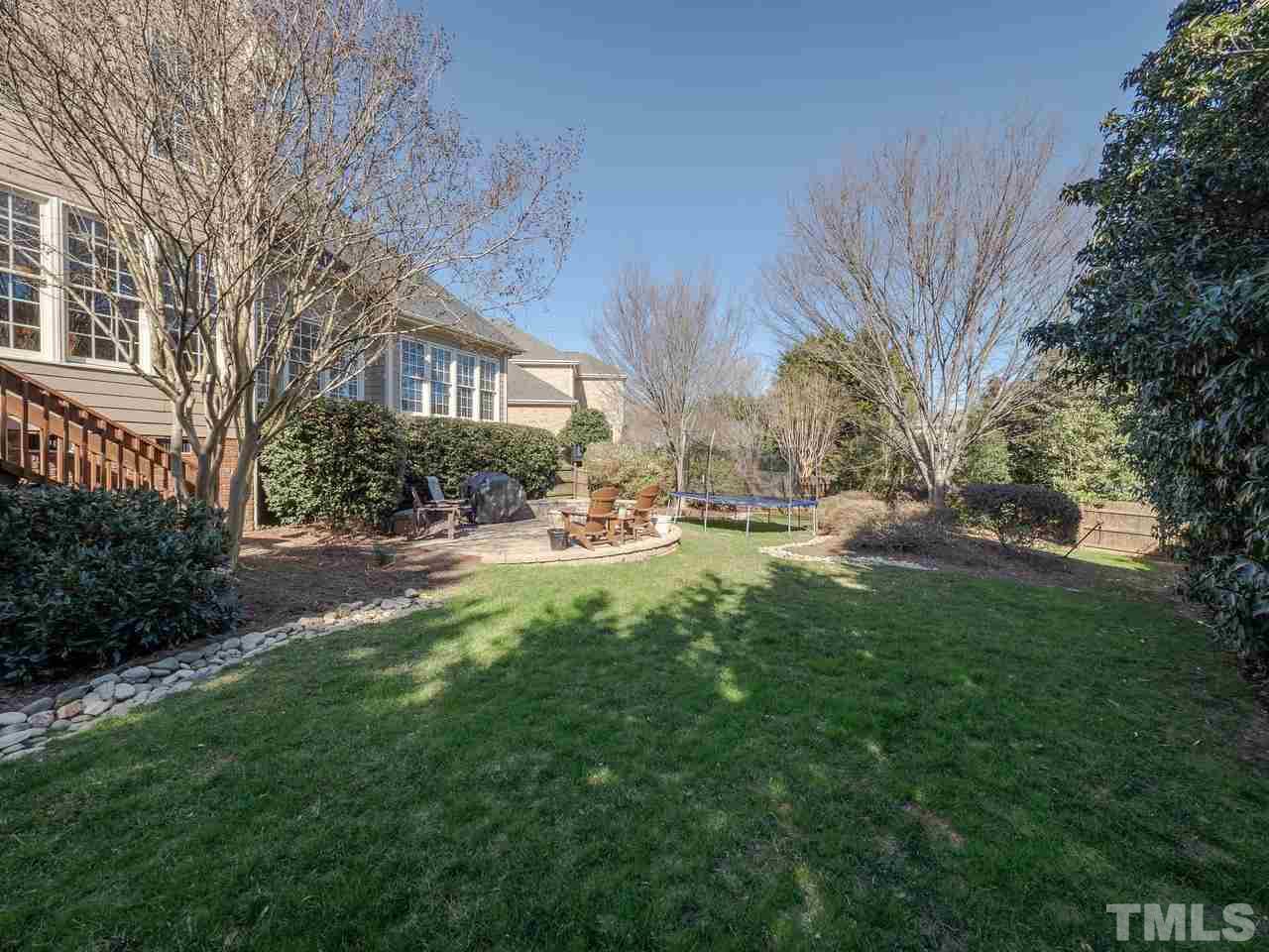 4604 Whitmire Place Raleigh, NC 27612 - Photo 24 of 25 a view of road with large trees