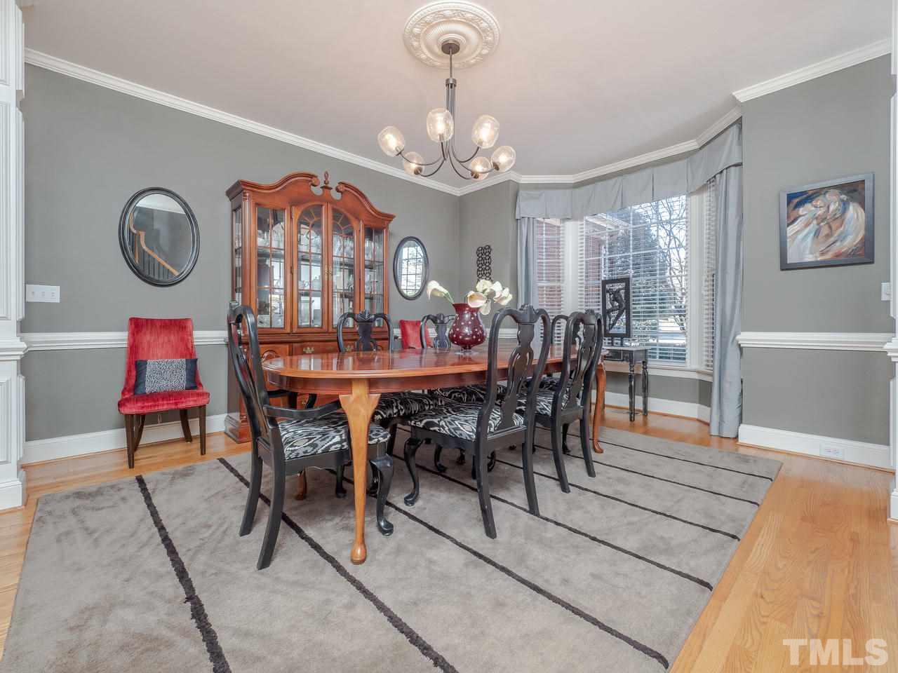 4604 Whitmire Place Raleigh, NC 27612 - Photo 5 of 25 a view of a dining room with furniture and chandelier