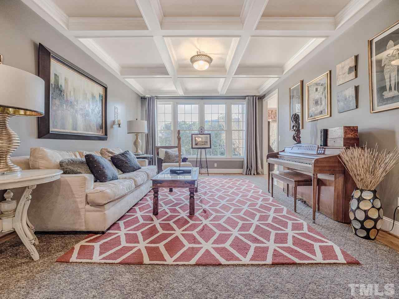 4604 Whitmire Place Raleigh, NC 27612 - Photo 6 of 25 a living room with furniture windows and a rug