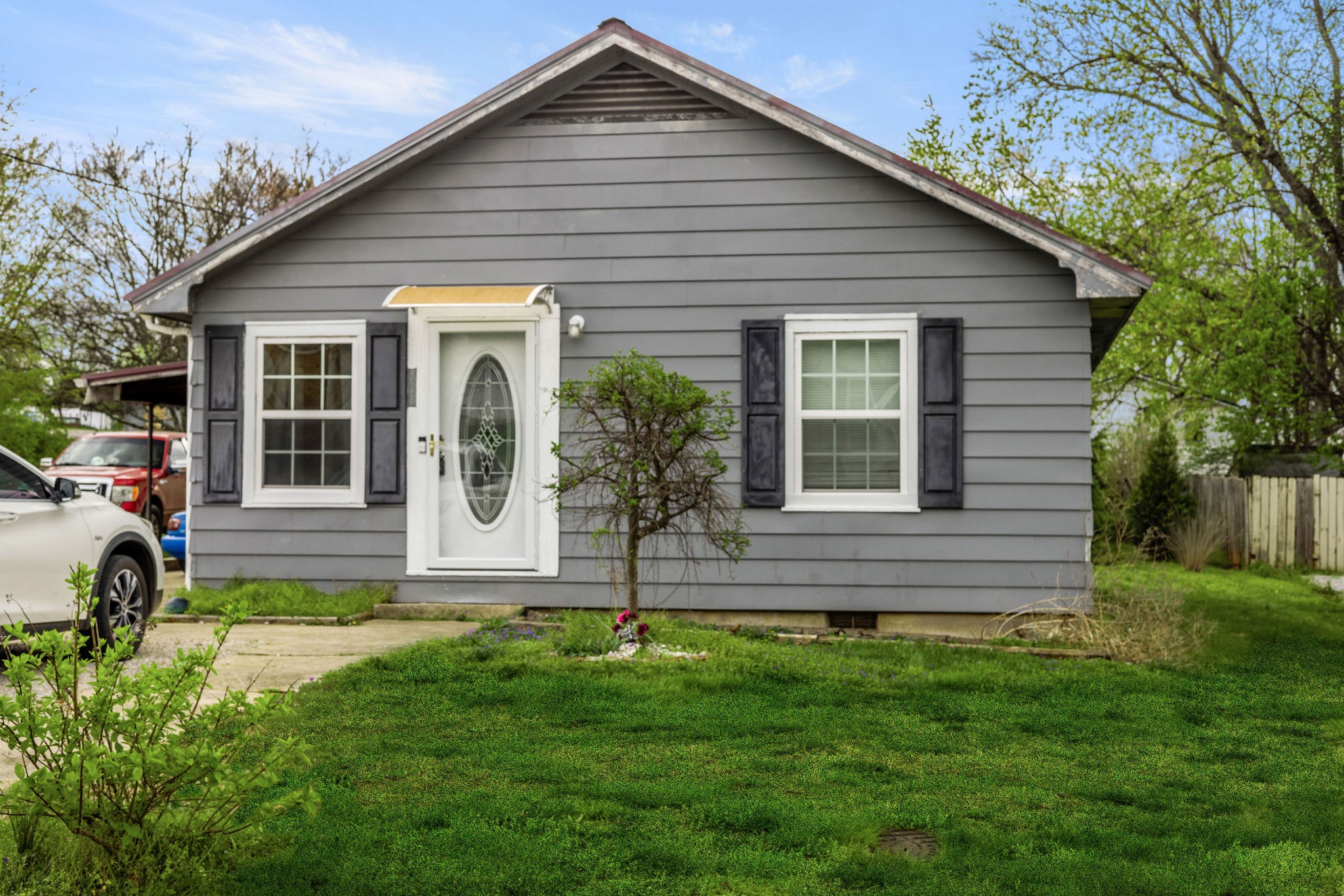 a front view of a house with a yard