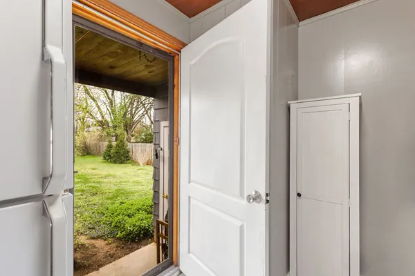 a view of a back yard from a room