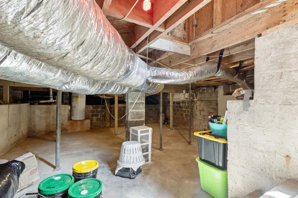 a view of a patio with table and chairs potted plants