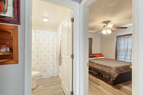 a view of a bedroom from a hallway