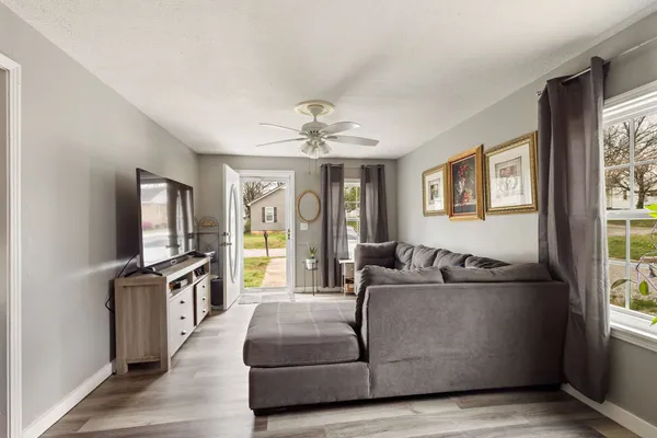 a living room with furniture and a flat screen tv