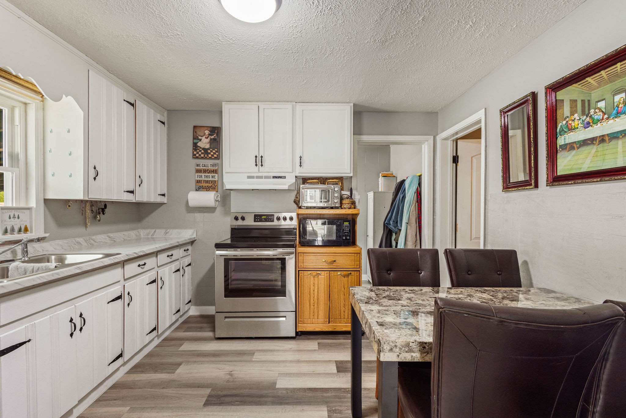 713 North Vine Street Winchester, TN 37398 - Photo 8 of 23 a kitchen with appliances cabinets and a sink