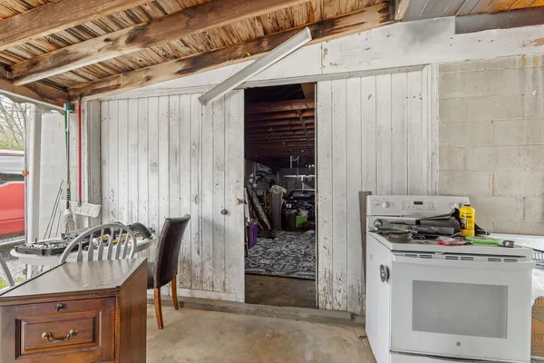 a kitchen with a refrigerator and a stove