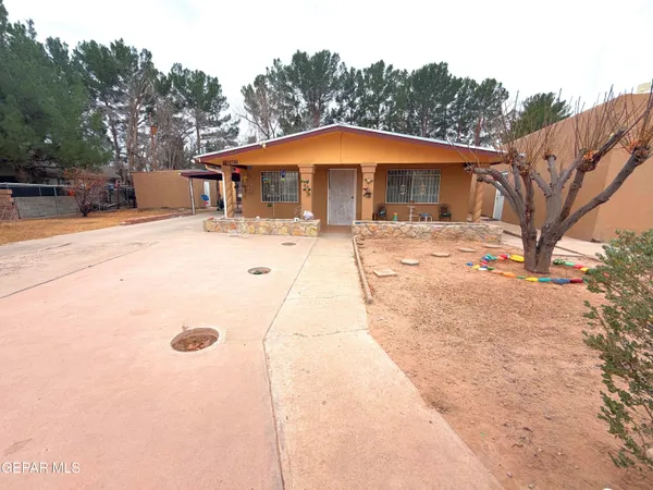a house with trees in the background