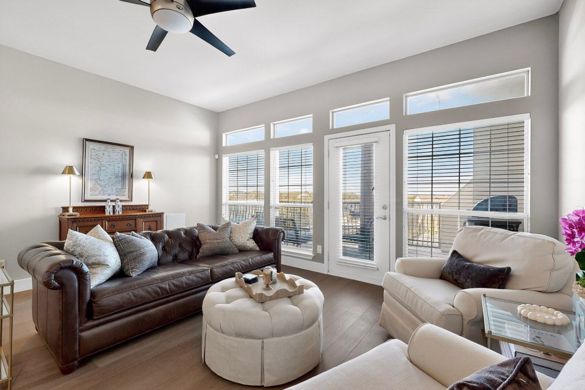a living room with furniture and a large window