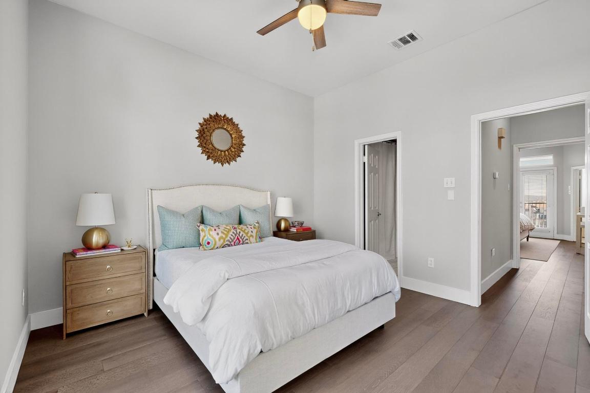 2918 Ranch Road 620 North, Unit T250 Austin, TX 78734 - Photo 15 of 22 a bedroom with a bed and wooden floor