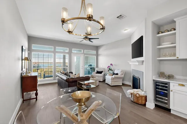 a living room with fireplace furniture and a flat screen tv