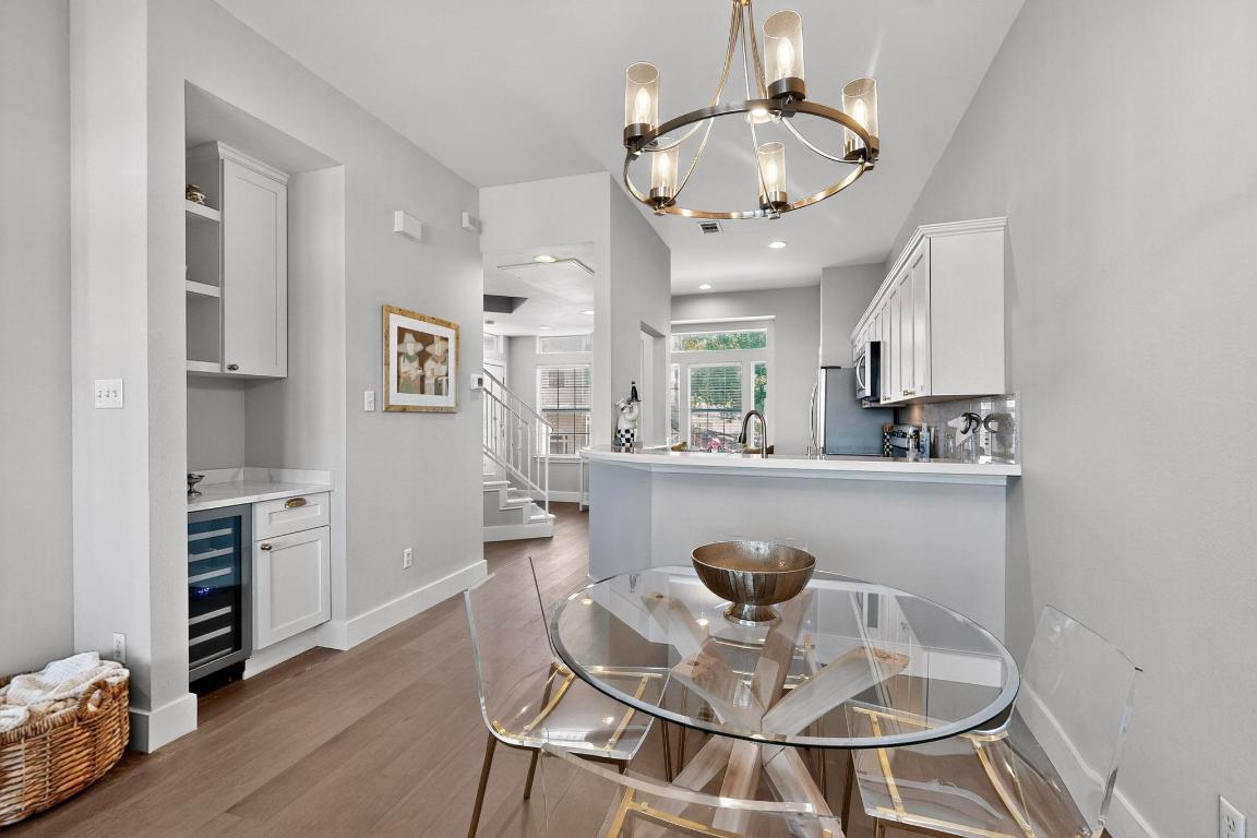 2918 Ranch Road 620 North, Unit T250 Austin, TX 78734 - Photo 6 of 22 a view of a dining room with furniture and wooden floor
