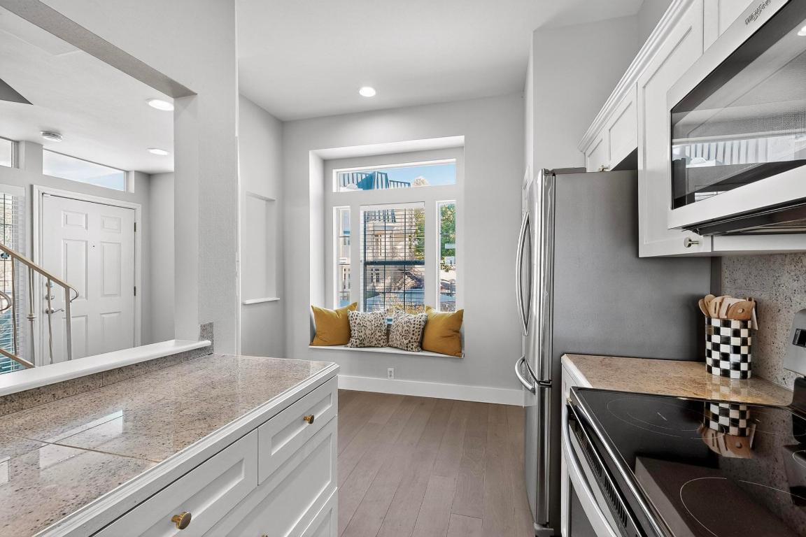 2918 Ranch Road 620 North, Unit T250 Austin, TX 78734 - Photo 9 of 22 a living room with stainless steel appliances furniture a couch and a large window