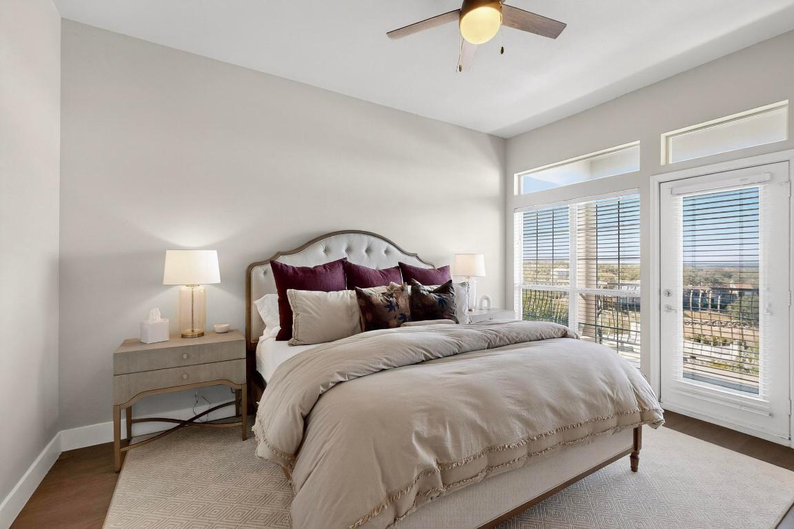 2918 Ranch Road 620 North, Unit T250 Austin, TX 78734 - Photo 10 of 22 a bedroom with a beds and a chandelier