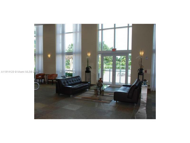 Gateway East Hallandale Beach, FL 33009 - Photo 1 of 12 a living room with furniture and large windows