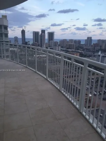 a view of a balcony with city view