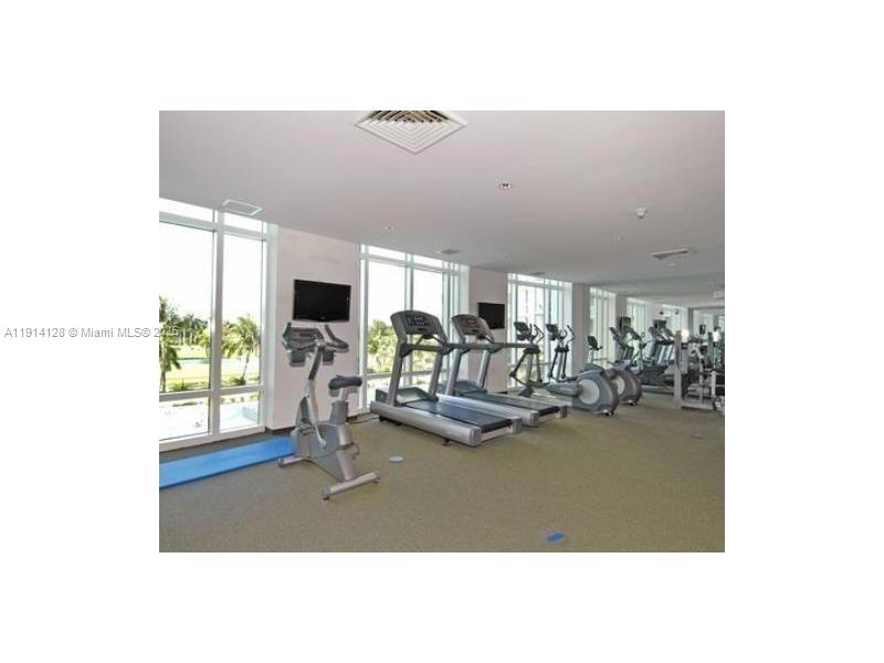 Gateway East Hallandale Beach, FL 33009 - Photo 3 of 12 a view of a living room with furniture and a floor to ceiling window