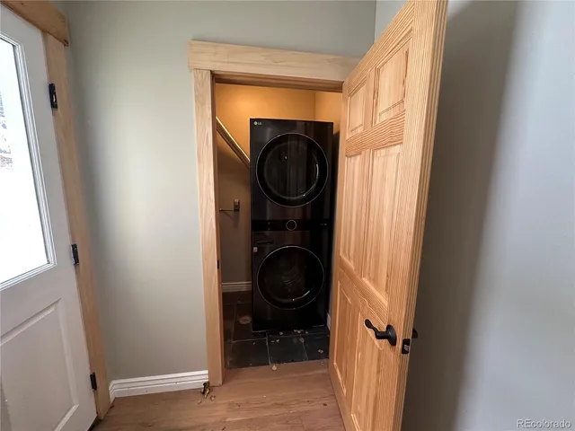 a view of a storage and utility room with a washer and dryer