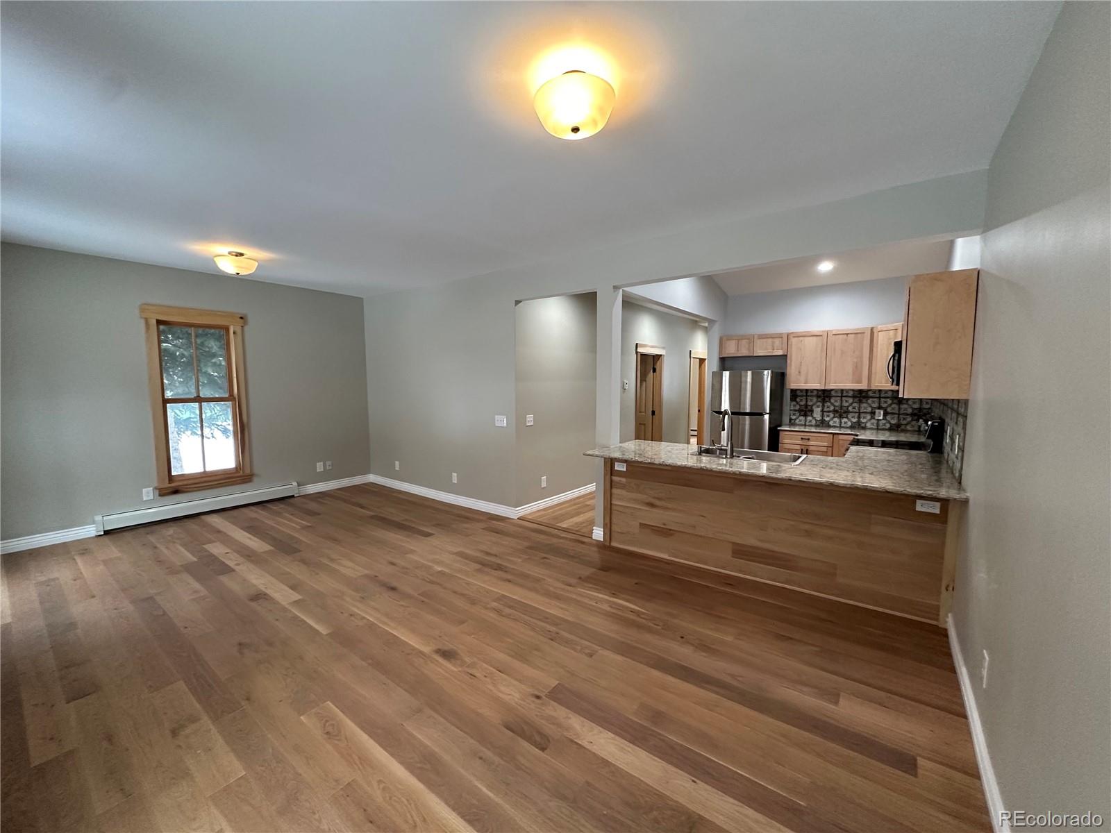 902 Rose Street Georgetown, CO 80444 - Photo 5 of 23 a view of kitchen and wooden floor