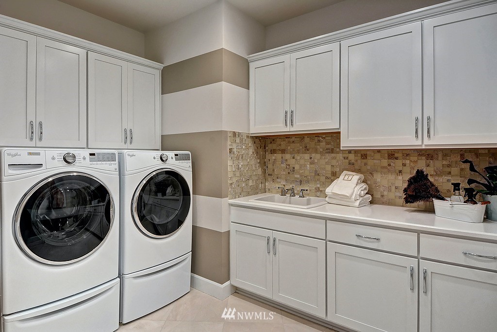 9911 Northeast 158th Street Bothell, WA 98011 - Photo 11 of 25 a utility room with sink dryer and washer