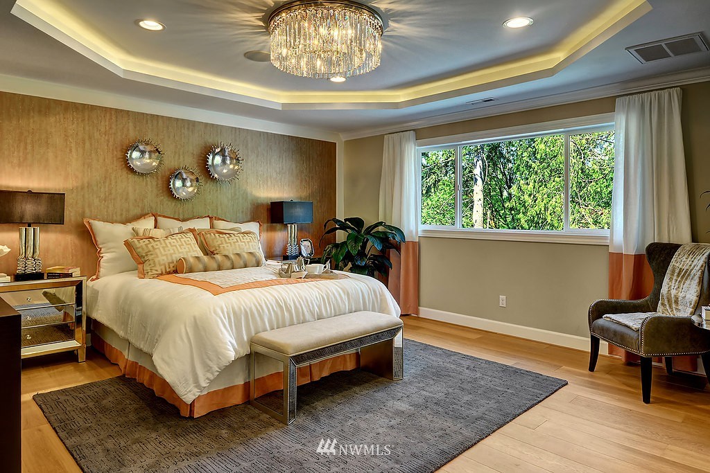 9911 Northeast 158th Street Bothell, WA 98011 - Photo 13 of 25 a bedroom with a bed and wooden floor