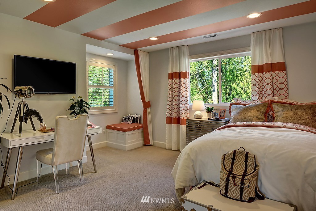 9911 Northeast 158th Street Bothell, WA 98011 - Photo 18 of 25 a living room with furniture a flat screen tv and a large window