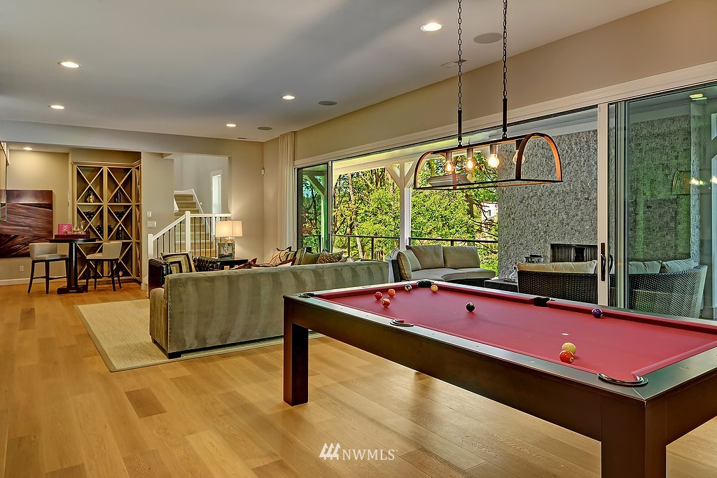 9911 Northeast 158th Street Bothell, WA 98011 - Photo 22 of 25 a room with pool table windows and outdoor view