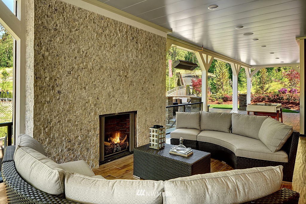 9911 Northeast 158th Street Bothell, WA 98011 - Photo 23 of 25 a living room with furniture and a fireplace